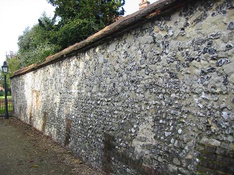 Old brick and flint wall behind Winchester Cathedral